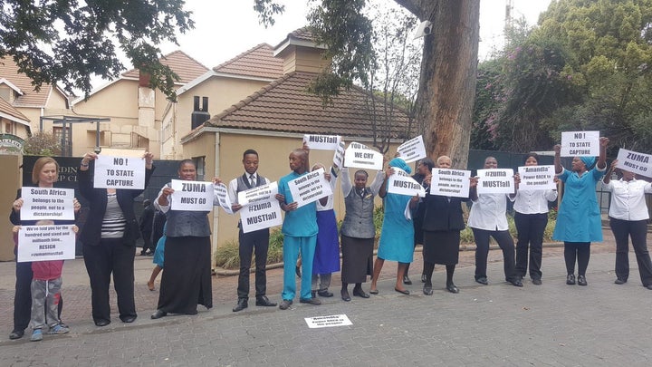Employees in the hospitality sector in Sandton use their lunch break to protest against Zuma.