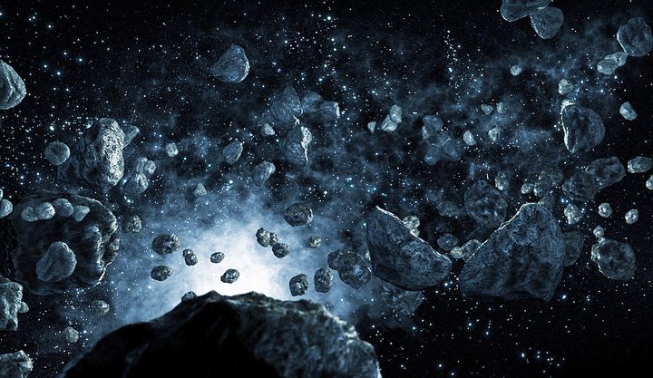 Artist rendering of asteroids in space.