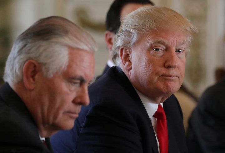 President Donald Trump, right, sits by Secretary of State Rex Tillerson at a meeting with China's President Xi Jinping in Florida the day after Trump ordered missile strikes on an air base in Syria.
