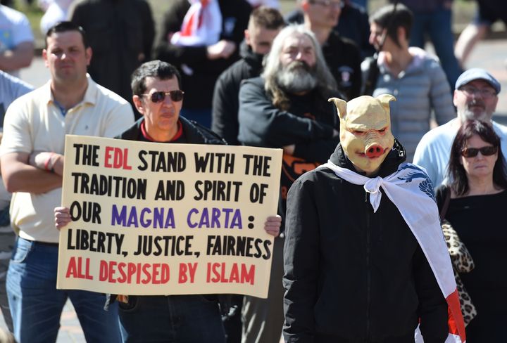 English Defence League (EDL) protestor in a pig mask.