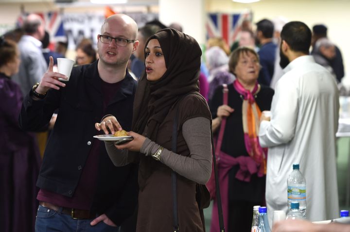 People chat during the party inside Birmingham Central Mosque.