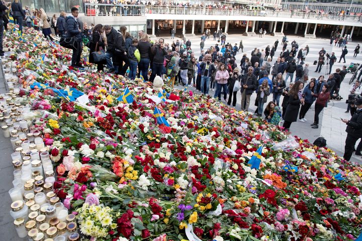 Steps along Sergels Torg, Stockholm's center square, are seen covered in vibrant flowers after Friday's deadly attack that left multiple people dead.