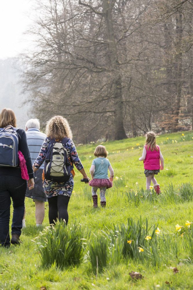 Visitors exploring the garden in springtime at Cliveden, Buckinghamshire National Trust