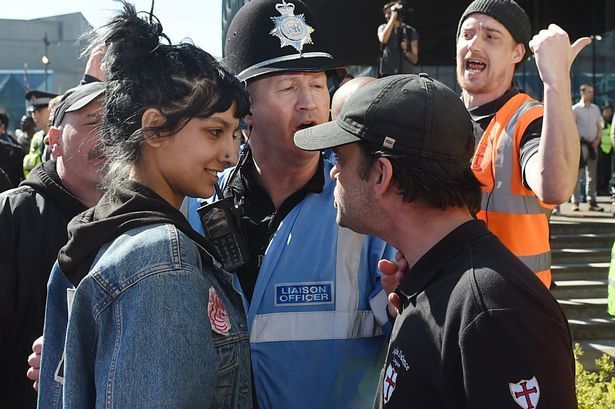 <p>Saffiyah Khan smiling at the face of the EDL leader.</p>