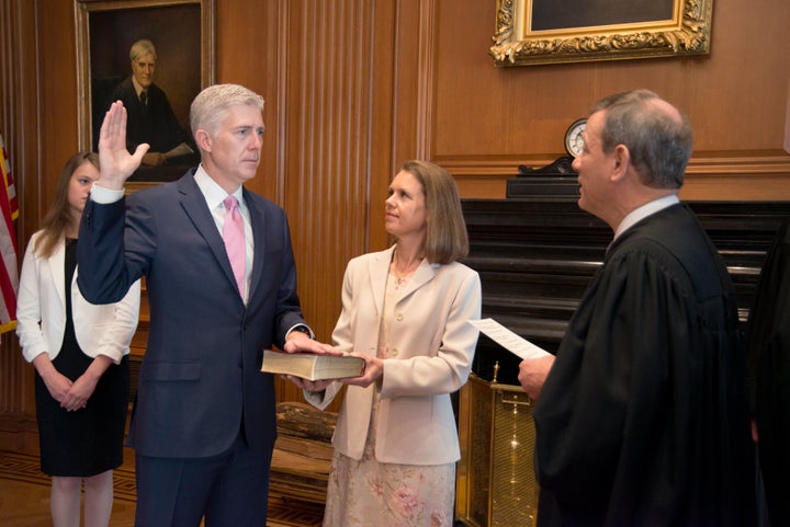 Chief Justice John Roberts administers the constitutional oath to Neil Gorsuch, President Donald Trump's Supreme Court nominee, in a private ceremony.