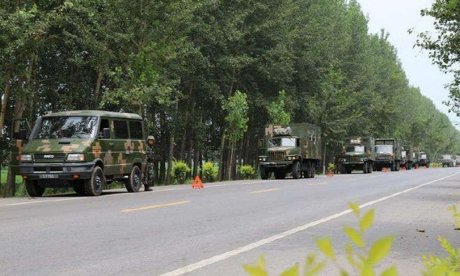 The PLA troops moving to the China-North Korea border. China has reportedly deployed as many as 150,000 soldiers on the borde