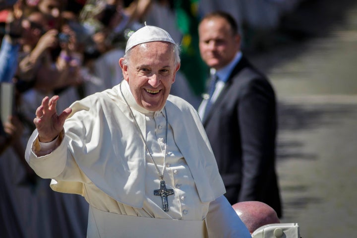 Pope Francis greets the faithful as he leaves at the end of the Palm Sunday Mass in St. Peter's Square.