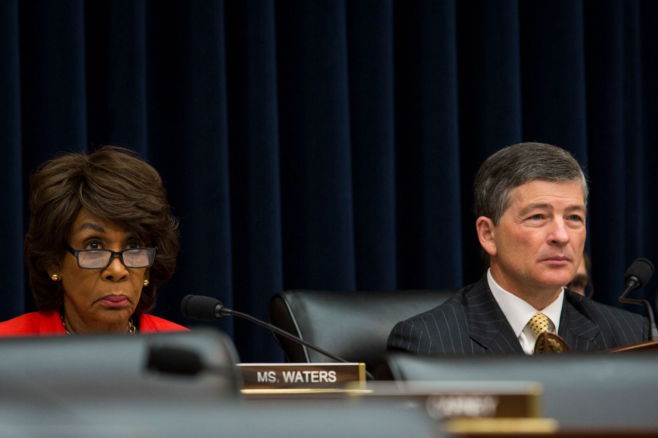 Waters and Financial Services Committee Chairman Jeb Hensarling (R-Texas) listen to testimony during a hearing.