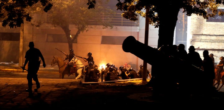 The Paraguayan capital briefly became a battleground between police, protesters and politicians.