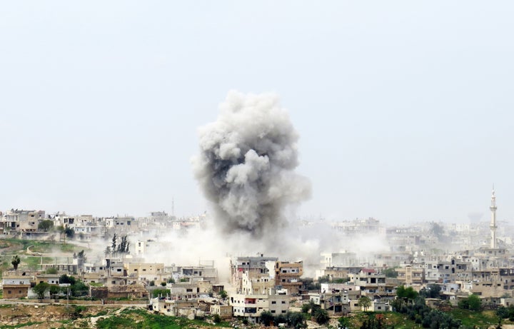 Smoke rises after Syrian Regime Forces bombed the Menshiyye neighborhood as opposition forces advance towards the center of Daraa, Syria on April 10, 2017.