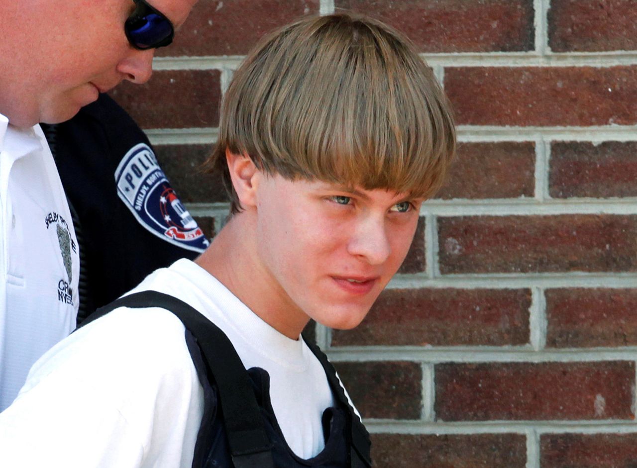 Dylann Roof, who killed nine people in a South Carolina church, is led into a courthouse on June 18, 2015. “There really is no difference between what happened in Charleston with Dylann Roof and what happened in San Bernardino,” says Christian Picciolini