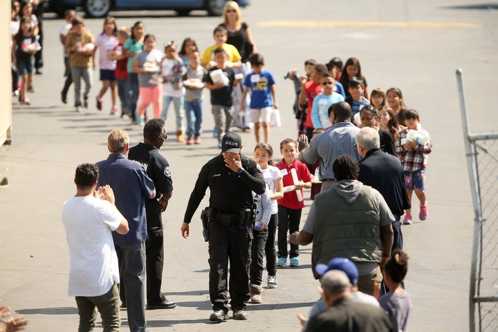 Children were forced to leave their classrooms following a deadly school shooting in San Bernardino, California, on April 10, 2017.