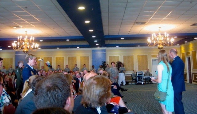 Lt. Gen. Bill Rew, with one of his daughters, by his side, thanking these 5 female officers for their service to our country
