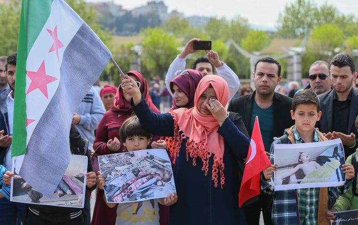 People gather in Izmir, Turkey, on April 7 to remember the Syrians who died in the Assad regime's latest chemical attack.