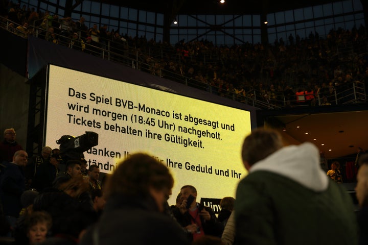 A sign in the stadium tells fans the game is postponed