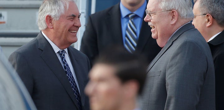 U.S. Secretary of State Rex Tillerson is welcomed by U.S. Ambassador to Russia John Tefft.