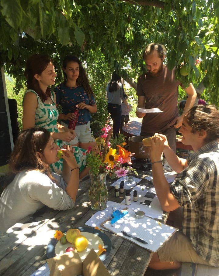 A few students attend a workshop at the garden.