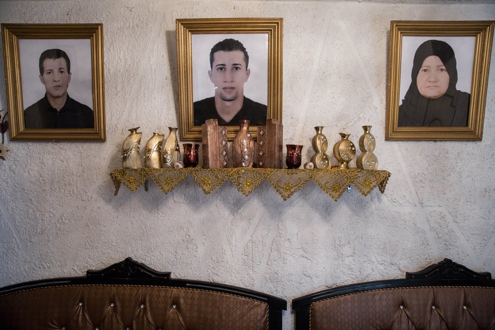 A portrait of Mohammad (center), who left Tunisia to join an extremist group in Syria and never returned, hangs in his family