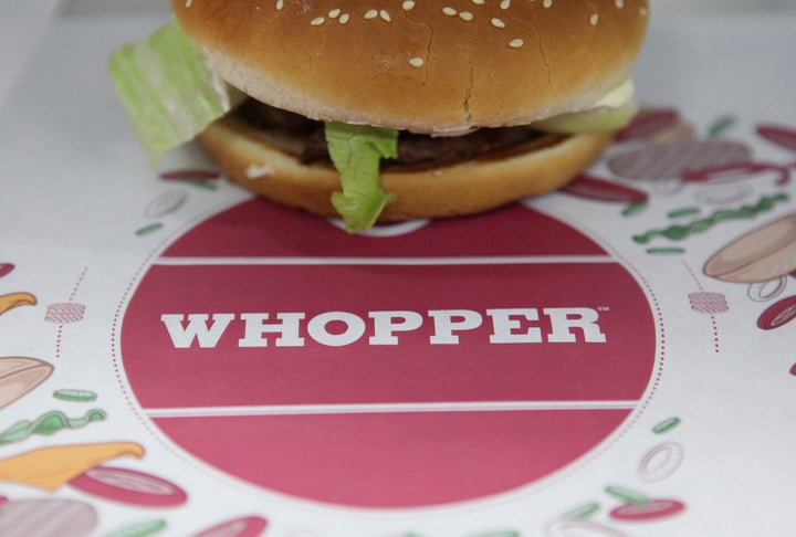 The 15-second video ad for Burger King's Whopper sandwich, pictured, is designed to trigger viewers' Google Home devices to describe the burger in detail.