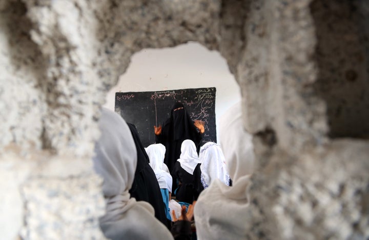 Yemeni students study in a classroom in the Yemeni port city of Hodeidah, on March 15, 2016.