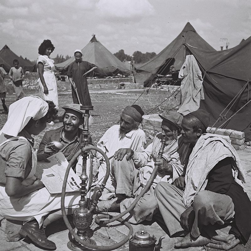 A young Yemenite nurse with Yemenite immigrants, Israel, 1949