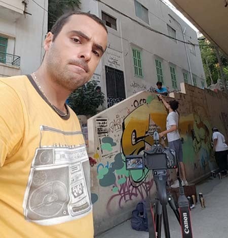 <em>Saab selfie with Beirut graffitti artists (courtesy Saab) </em>