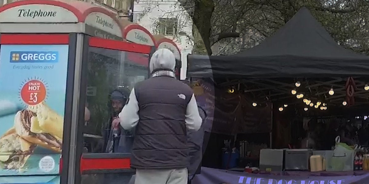 A woman passes a bag of an unknown substance to a man in a phone box on Piccadilly Gardens, Manchester this week