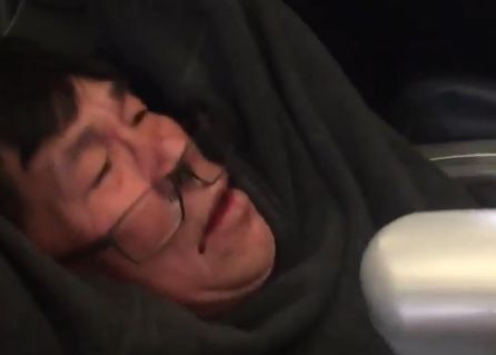A still from a video of Dao being pulled from the flight showing his face bloodied in the now infamous incident.