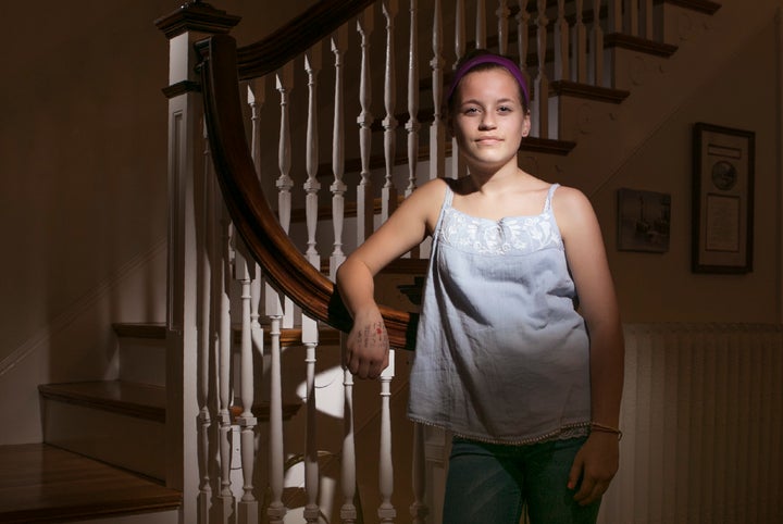 Molly Neuner poses for a photo in her Portland home after school on Wednesday, April 12, 2017. Her decision to wear the tank top was a deliberate protest against the dress code policy at King Middle School, where she goes to school.