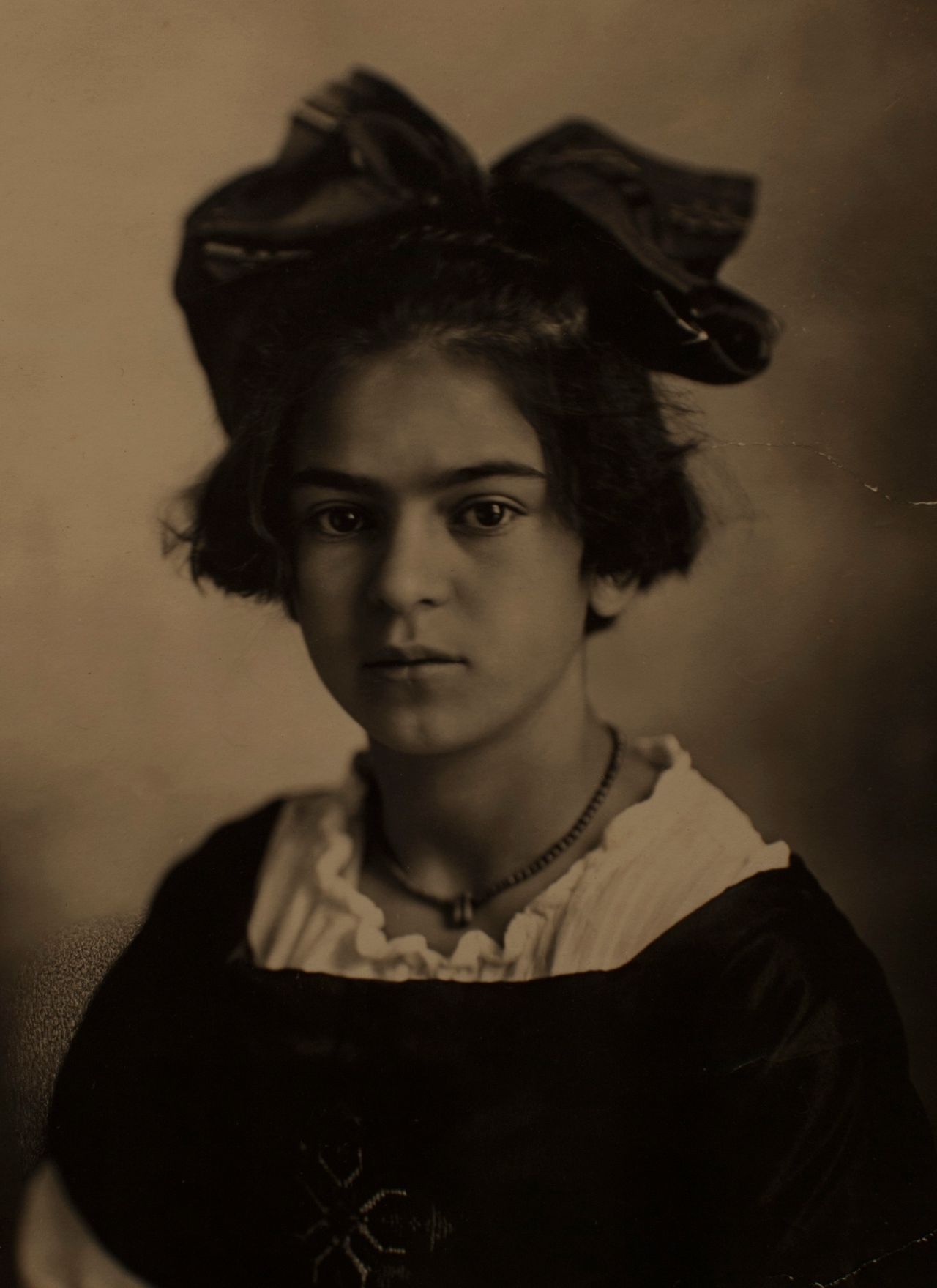A portrait of Frida Kahlo by her father, Guillermo Kahlo, is displayed at the Frida Kahlo museum in Mexico City.