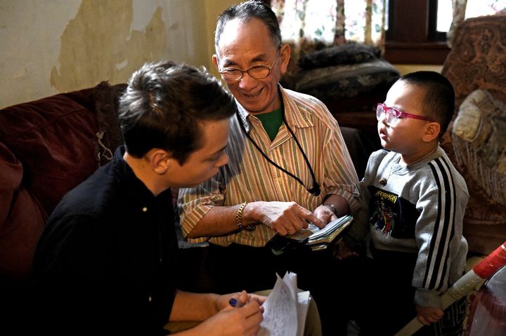 Ya Pao Lee, center, talks to student Henry Pellegrin about his experiences as a soldier in the Vietnam War as part of the City Stay cultural immersion program, March 16, 2016.