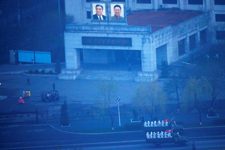 Military trucks carry soldiers through central Pyongyang before sunset as the capital preparers for a parade marking today's 105th anniversary of the birth of Kim Il Sung, North Korea's founding father and grandfather of the current ruler, April 15, 2017. (REUTERS/Damir Sagolj)