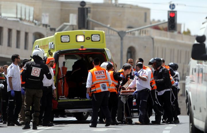 Israeli medics treat Bladon at the scene of the attack, just outside Jerusalem's Old City