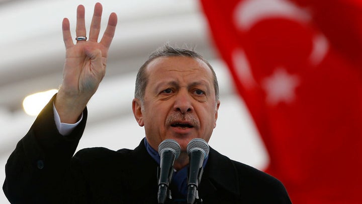 Erdogan with “Rabia” sign during a rally to extend his support to the <strong>Muslim Brotherhood. </strong>