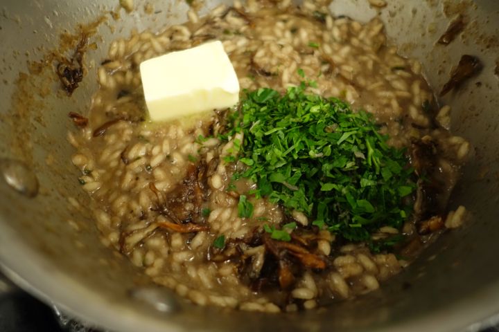 The finished risotto: sauteed maitake caps added, and butter and herbs about to be vigorously stirred in. We ate too avidly to permit a final plated photograph