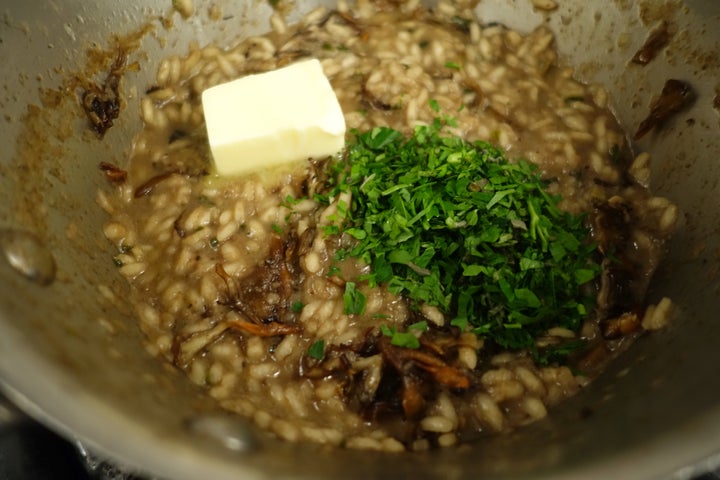 The finished risotto: sauteed maitake caps added, and butter and herbs about to be vigorously stirred in. We ate too avidly to permit a final plated photograph