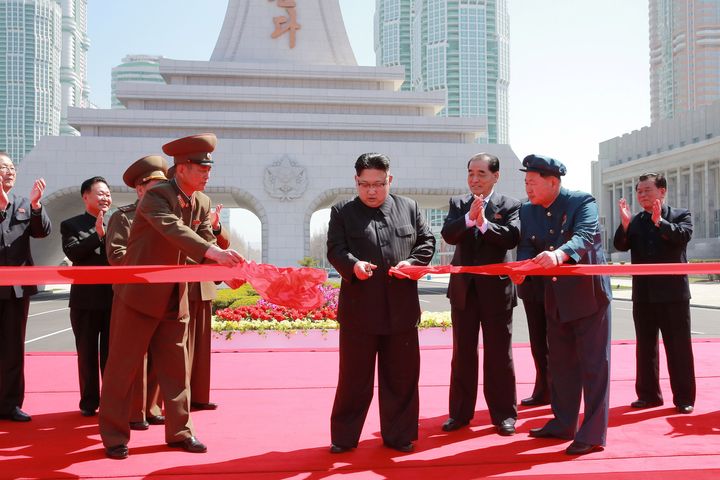 North Korea's leader Kim Jong Un cuts a ribbon during a ceremony in Pyongyang. 