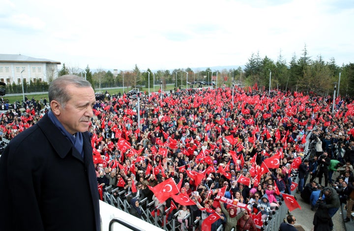 Erdogan greets the crowd, who were waiting to celebrate the results of the referendum, after he arrived in the Esenboga International Airport in Ankara, Turkey on April 17.