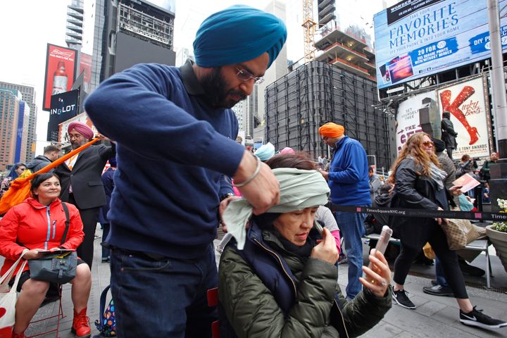 Sikhs of New York organized a Turban Day in Times Square. Volunteers were on hand to help tie traditional Sikh turbans for all, some followers of the religion, others not.