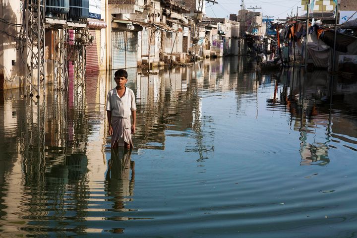 Floods hit a village in Pakistan. People living in poverty are hit hardest by climate change.