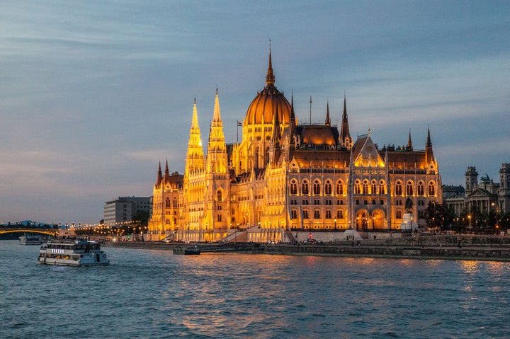 <p>The House of Parliament, fronting the Danube River in Budapest, Hungary, seems every bit the fairy castle when seen at sunset from the deck of the Scenic Pearl. Budapest, Hungary.</p>