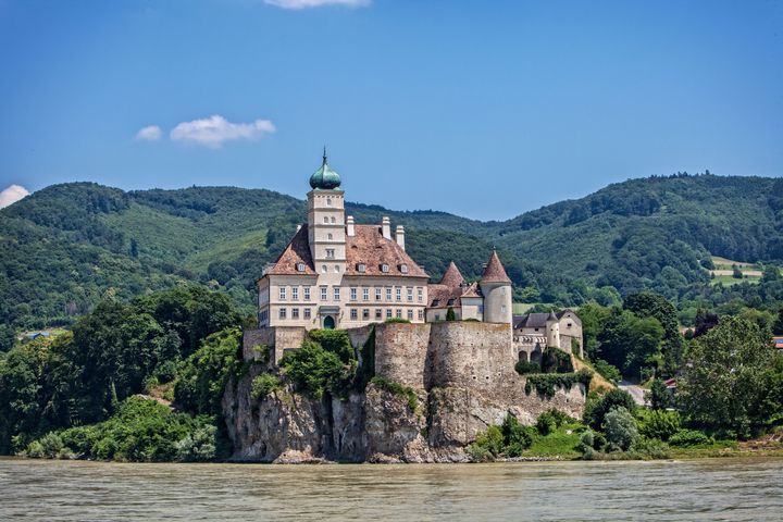 A classic cliff-side pile overlooking a slight bend in the Danube, this castle, not far from the 18th C. Benedictine Abbey and Library at Melk, was identified by the ship’s crew as Schonbuhel Schloss (Castle). Built atop a rock fronting the river, it’s invincible from below and enjoys clear views up and down the Danube. Unlike many ruined castles along the Danube, Schonbuhel has survived intact. Near Melk, Austria.