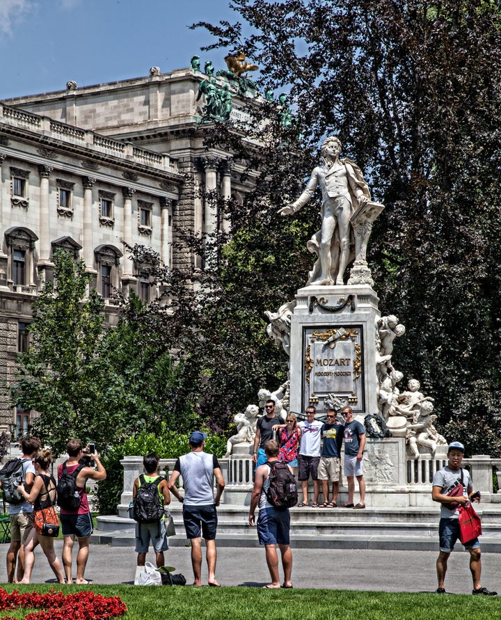 As everywhere in Austria, Mozart is a hero. Put him on a pedestal, surround him with green grass and a set of steps, and they will come. A photo op in Vienna, Austria. 