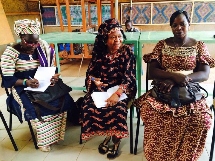 Community leaders from various weaving groups in West Africa attending a monthly meeting to discuss the expansion of their network.