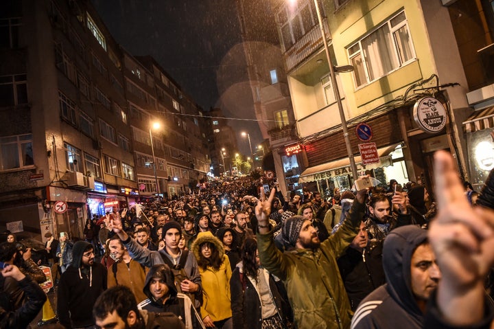 Supporters of the 'No' gesture and shout as they gather at the Besiktas district in Istanbul on April 17, 2017 to protest fol