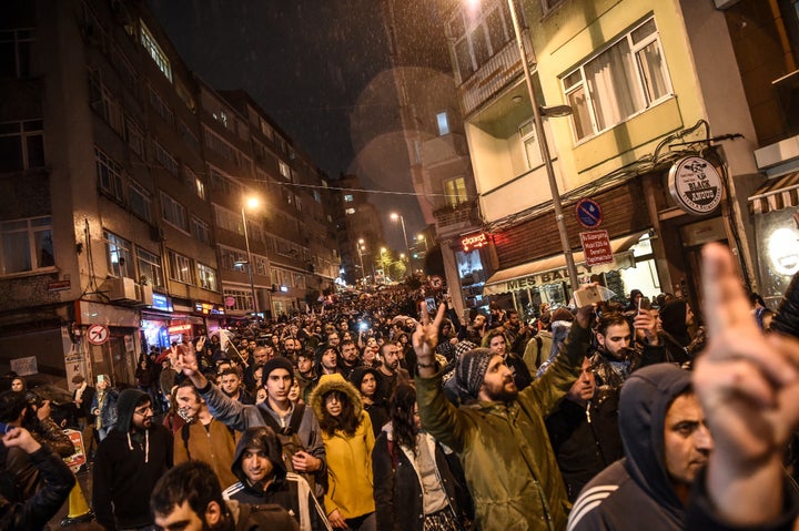 Supporters of the 'No' gesture and shout as they gather at the Besiktas district in Istanbul on April 17, 2017 to protest following the results in a nationwide referendum that will determine Turkey's future destiny