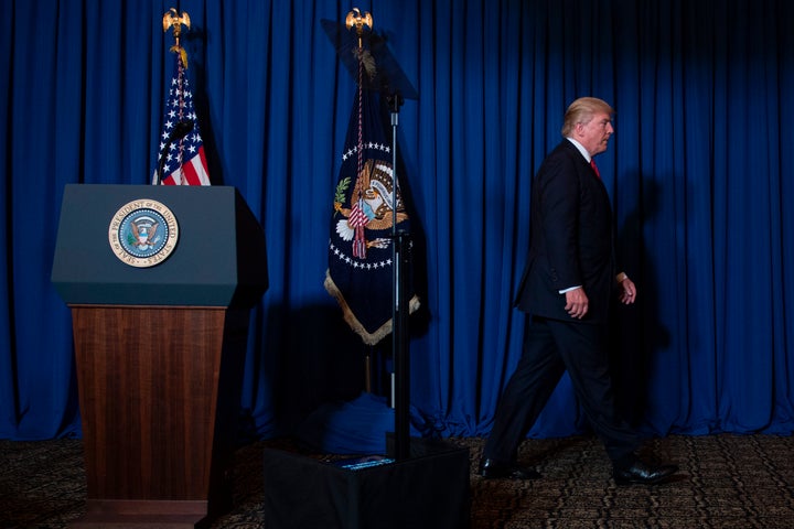 President Donald Trump departs after delivering a statement on Syria from the Mar-a-Lago estate in West Palm Beach, Florida,