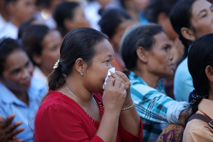<p>Parents listening to music performed by students in their village community during student award ceremony at Aranh Sakor High School in Siem Reap. </p>