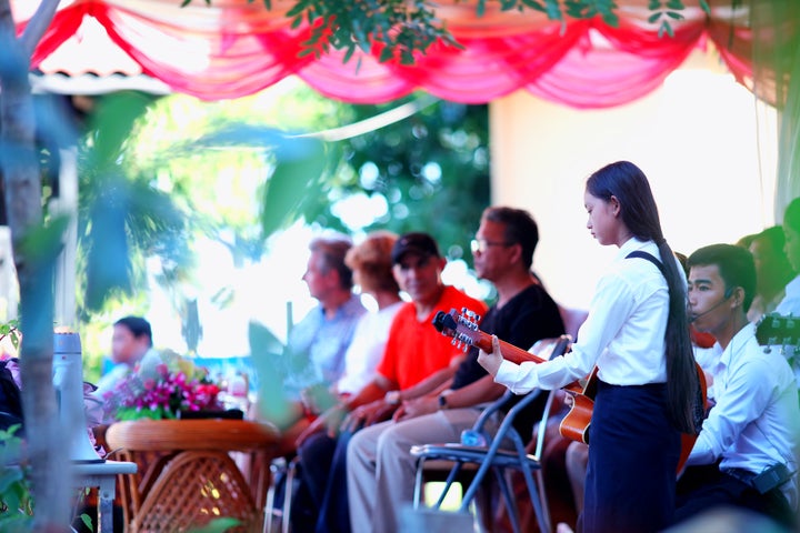 <p>Students playing music during student award ceremony at the Caring for Cambodia (CFC) Aranh Sakor High School in Siem Reap </p>