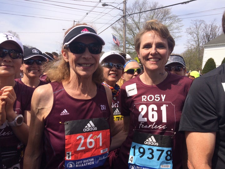 Switzer, left at Boston marathon starting line in Hopkinton, Mass, accompanied by Rosy Sprager, a 261 Fearless team member.